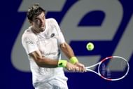 Sebastian Ofner hits a backhand